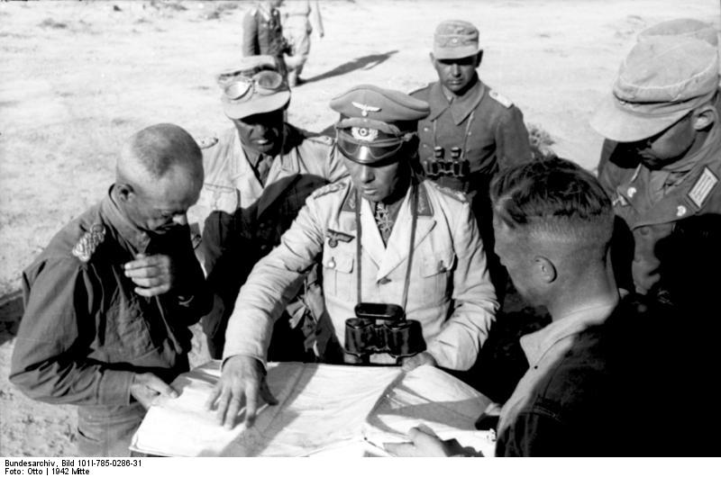 Colonel General Erwin Rommel and Major General Georg von Bismarck of 21. Panzerdivision studying a map in the field, North Africa, early summer 1942, photo 1 of 2
