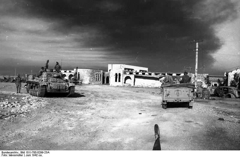 Erwin Rommel and Fritz Bayerlein inspecting Toburk, Libya, circa Jun 1942; note Panzer III tank to the left