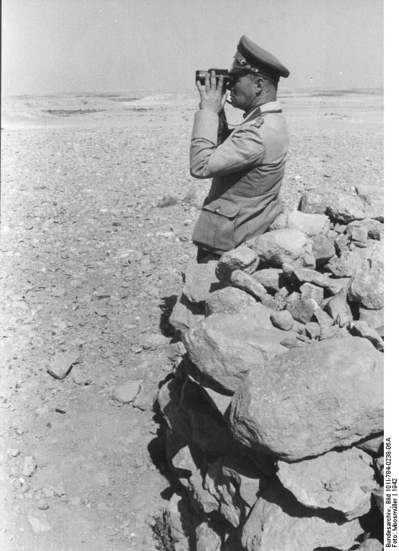 Colonel General Erwin Rommel observing the field with binoculars, North Africa, 1942, photo 1 of 2