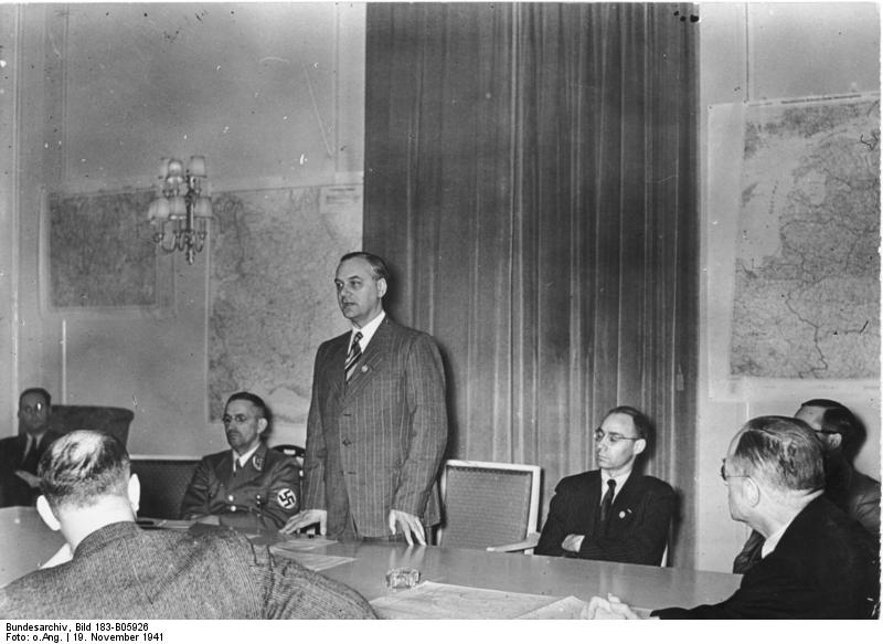 Alfred Rosenberg speaking at a press conference regarding his appointment to the eastern territories, 19 Nov 1941; also present were Gauleiter Alfred Meyer and state press chief Wilhelm Weiss