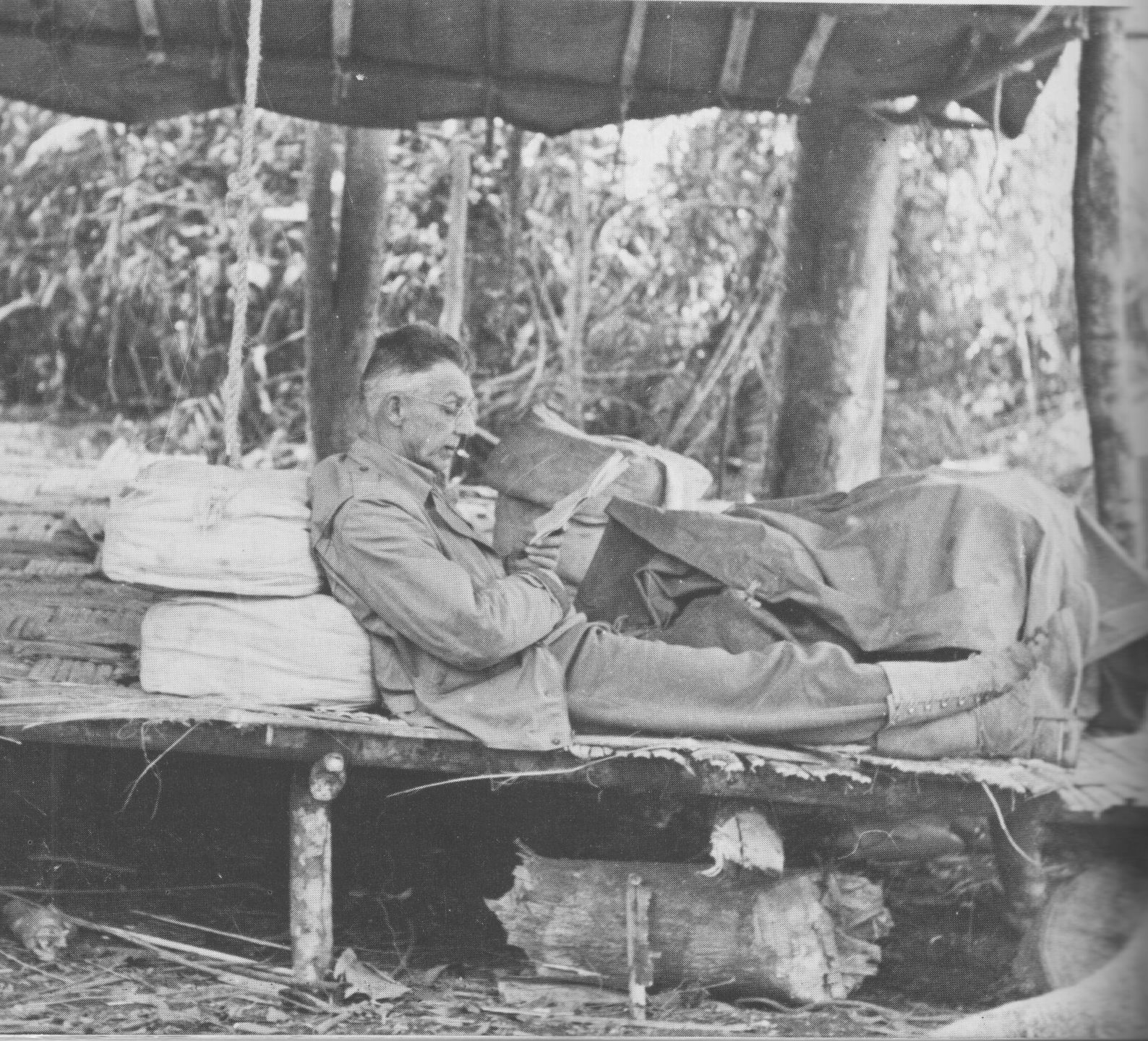 General Joseph Stilwell reading a letter at the Forward Echelon Headquarters, Taihpa Ga, Burma, 23 Feb 1944