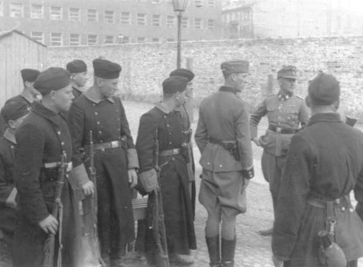 Jürgen Stroop with Polish or Ukrainian policemen in Warsaw, Poland during the ghetto uprising, May 1943