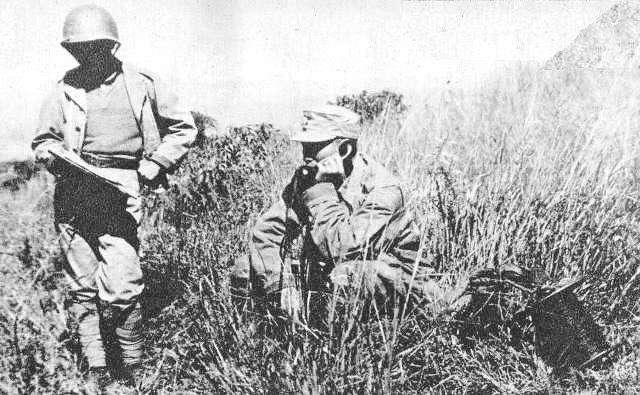 Chinese Army General Sun Li-jen talking on a field telephone, circa 1942