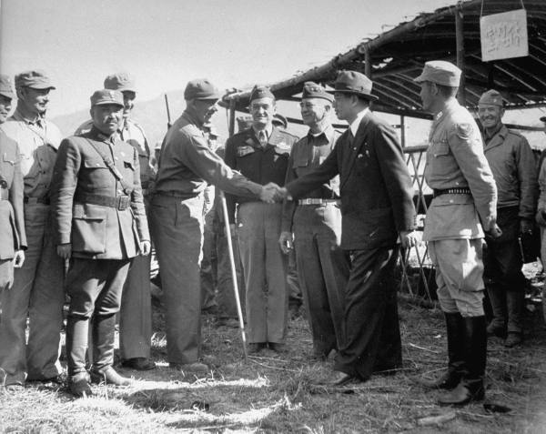 US General Lewis Pick shaking hands with Chinese politician Song Ziwen, India, Feb 1945; also present were US General Daniel Sultan, US General Claire Chennault, and Chinese General Sun Liren
