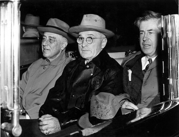 US President Franklin Roosevelt, Harry Truman, and Vice President Henry Wallace in a car, en route from Union Station to Capitol, Washington DC, United States, 10 Nov 1944