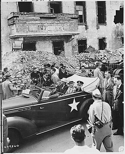 US President Harry Truman, Secretary of State James Byrnes, and Fleet Admiral William Leahy touring the ruins of Hitler's Chancellery, Berlin, Germany, 16 Jul 1945