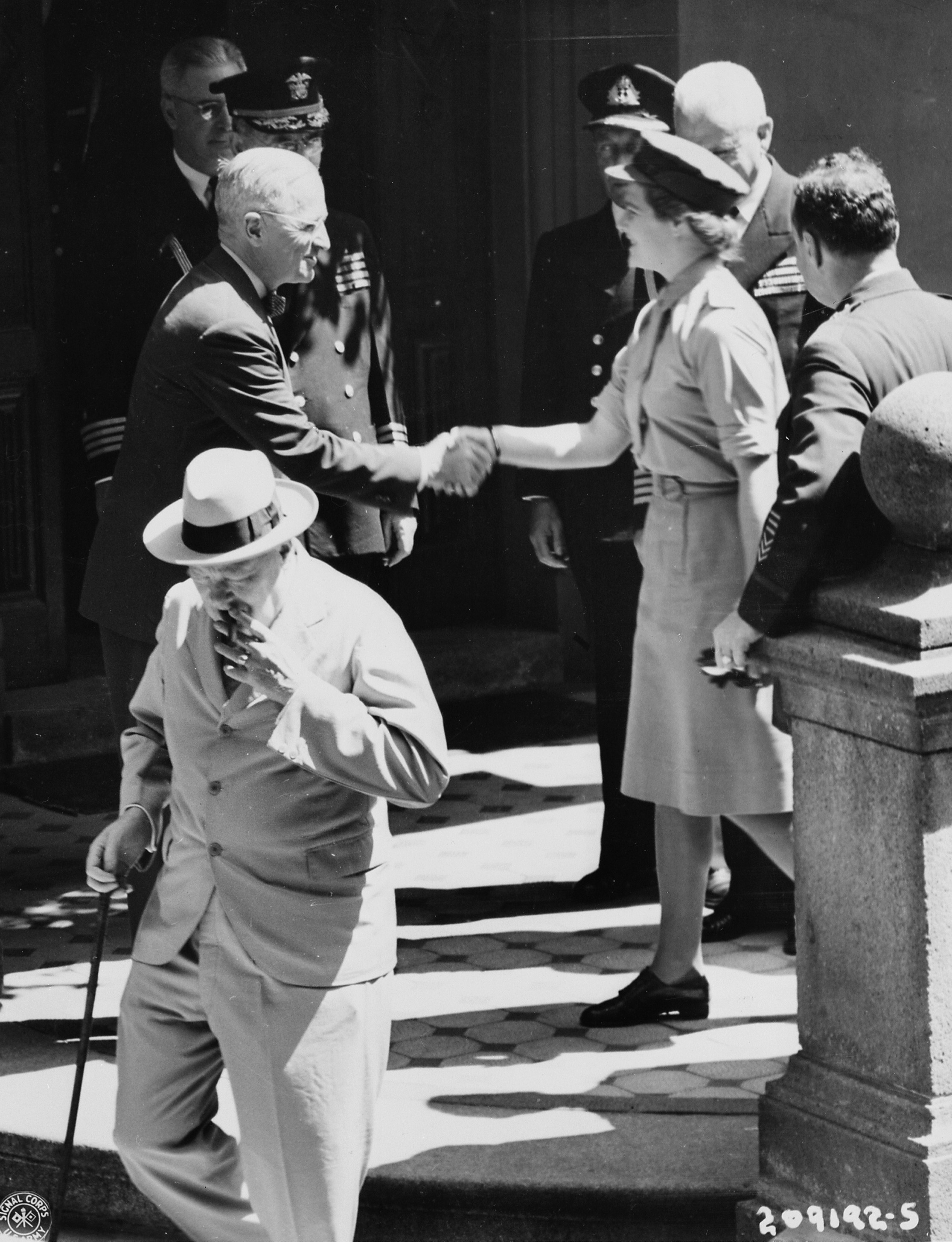 Harry Truman saying goodbye to Mary Churchill after meeting at his residence during Potsdam Conference, Germany, 16 Jul 1945; note presence of Winston Churchill, William Leahy, Dwight Eisenhower, and Harry Vaughn