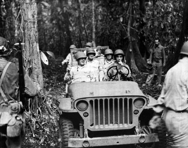 LGen Thomas Holcomb (left front), Col Merritt Edson (right rear), and MGen Alexander Vandegrift touring Guadalcanal, Solomon Islands, Nov 1942
