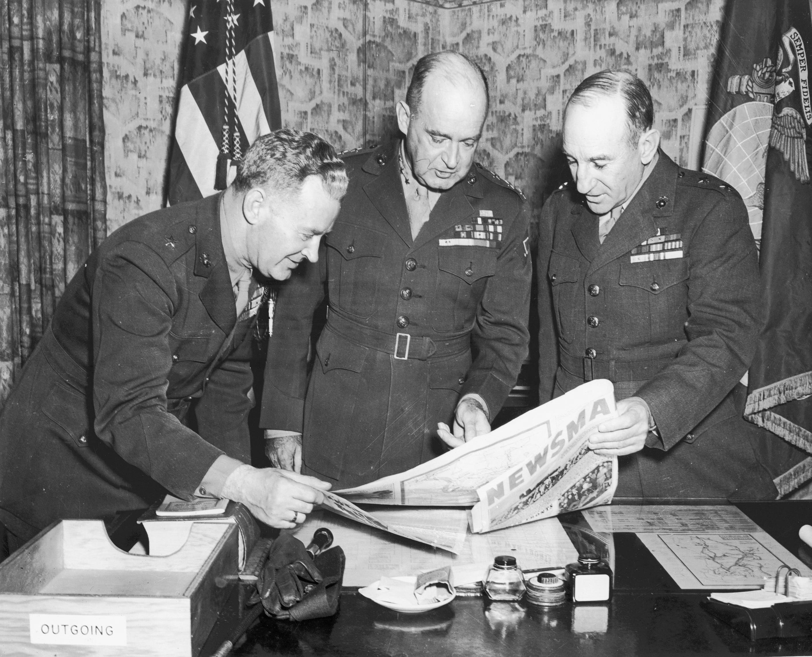 Leo Hermle, Alexander Vandegrift, and Julian Smith looking at a Newsmap, New Zealand, 21 Sep 1943