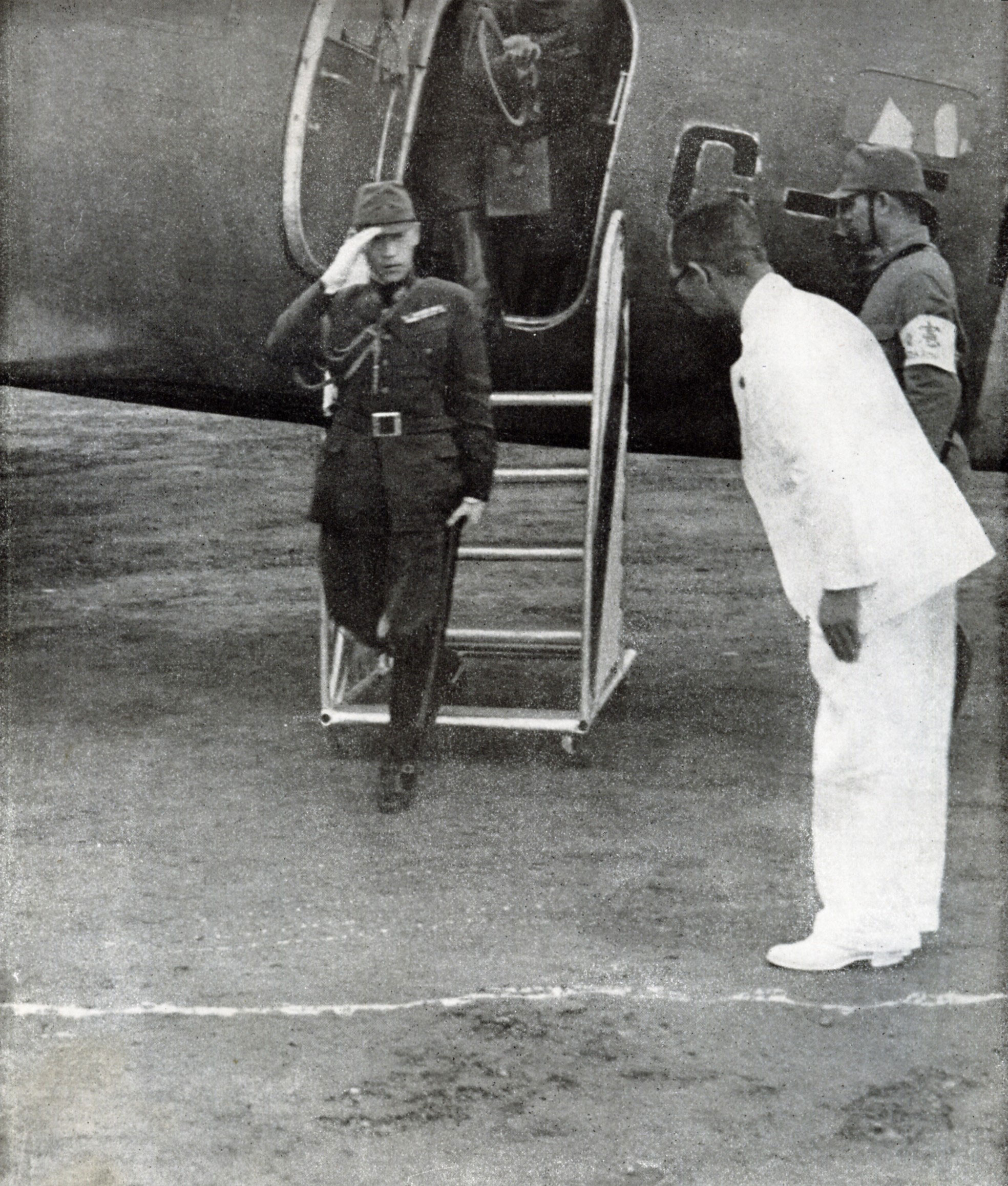 Prince Yi U exiting an aircraft, Philippines, 1 Jun 1943