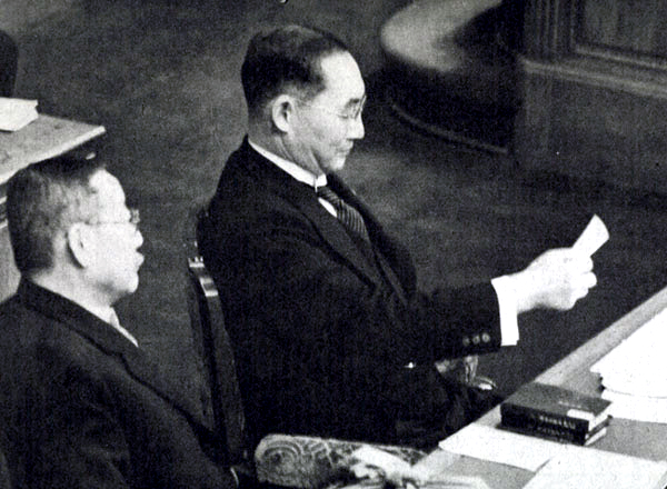 Japanese Prime Minister Mitsumasa Yonai reading a memo in the prime minister's seat in the Parliament chamber, Tokyo, Japan, 2 Feb 1940
