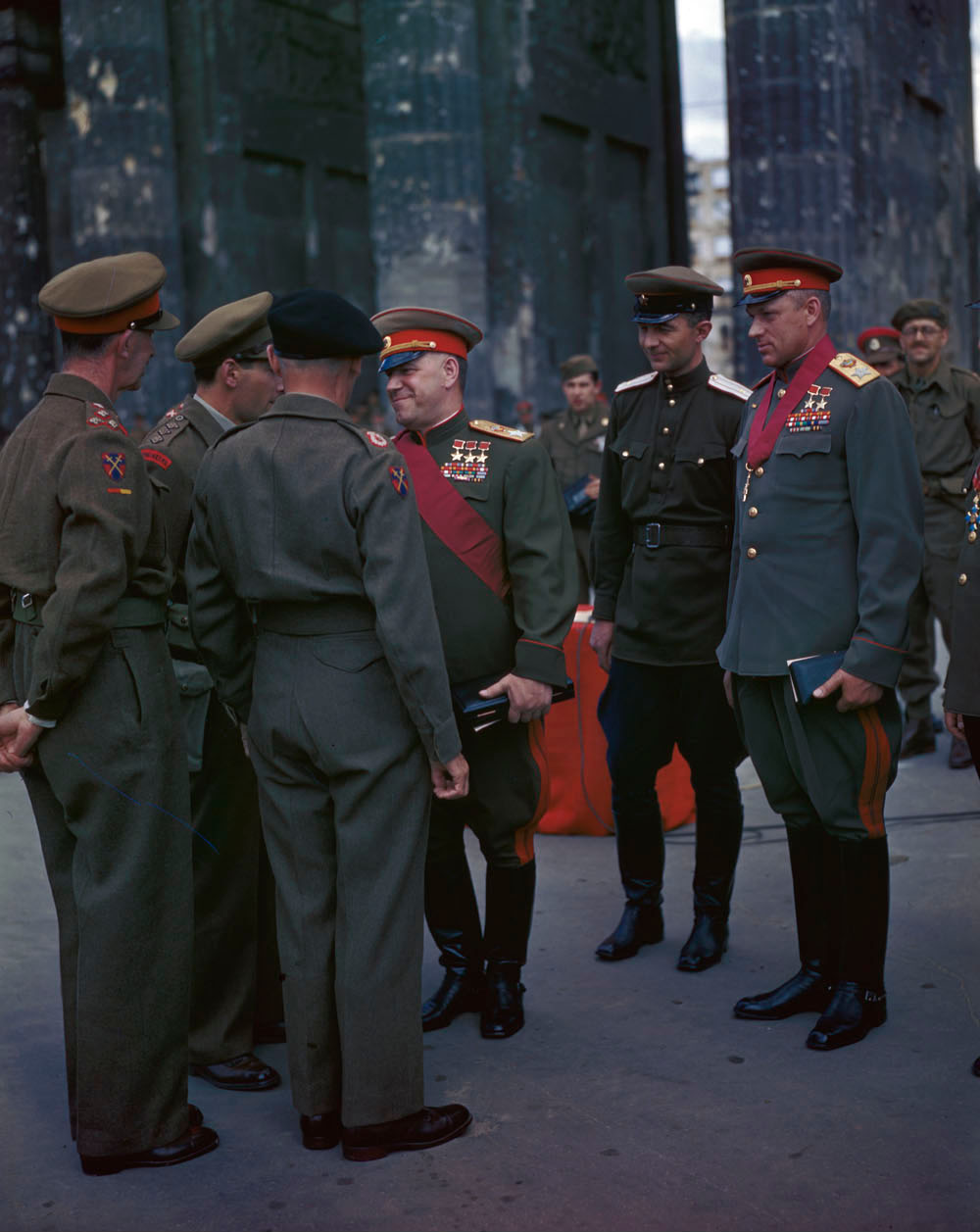 Georgi Zhukov, Konstantin Rokossovsky, and other Soviet officers greeting Bernard Montgomery and other British officers at the Brandenburg Gate, Berlin, Germany, 12 Jul 1945