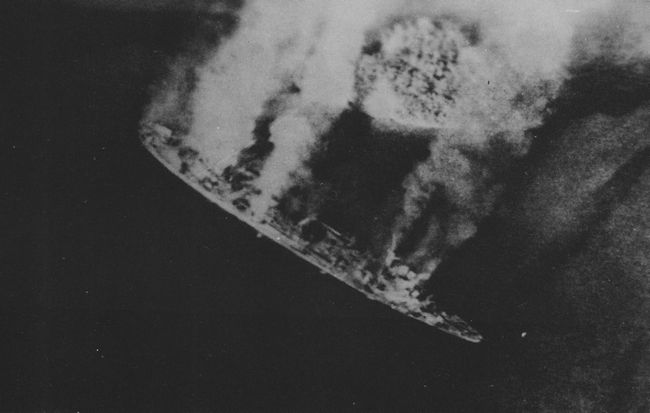 Repair ship Akashi burning as the result of US carrier aircraft attack, Palau Islands, 30 Mar 1944