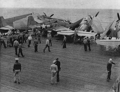 FM-1 aircraft having crashed into several TBF aircraft while landing on the flight deck of USS Coral Sea, 11 Oct 1943, photo 1 of 3
