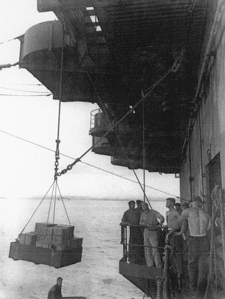 Loading stores on No. 5 sponson aboard USS Coral Sea, 6 May 1944
