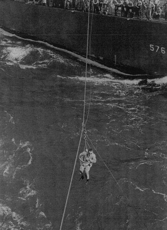 Lieutenant (jg) E. S. Taylor being transferred from USS Murray to USS Coral Sea, 30 Jan 1944