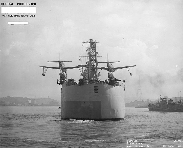 Stern view of USS Astoria, off Mare Island Naval Shipyard, California, United States, 21 Oct 1944; note OS2U Kingfisher aircraft