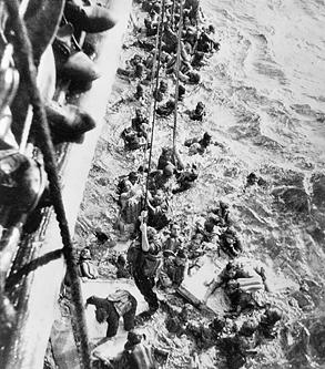 Survivors of battleship Bismarck being pulled aboard HMS Dorsetshire, 27 May 1941