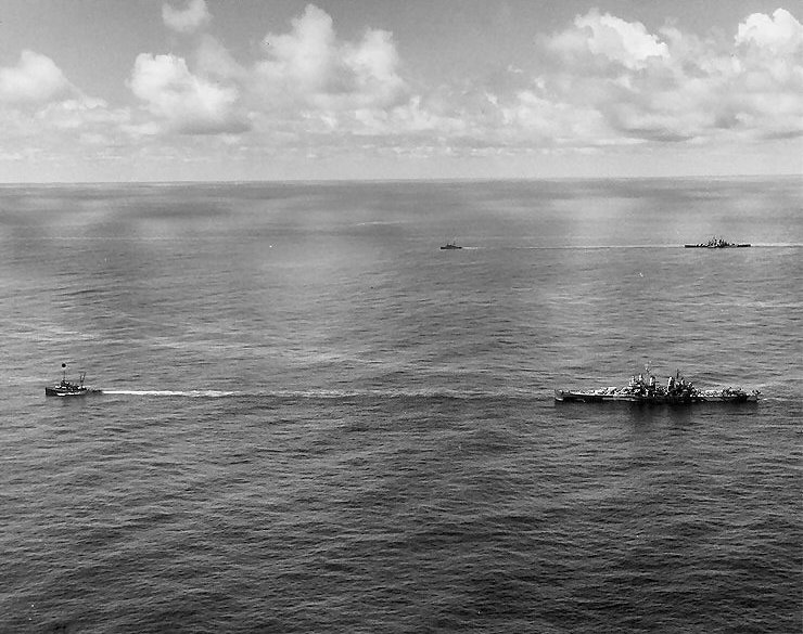 Canberra and Houston being towed by USS Munsee and USS Pawnee toward Ulithi, Caroline Islands, Oct 1944