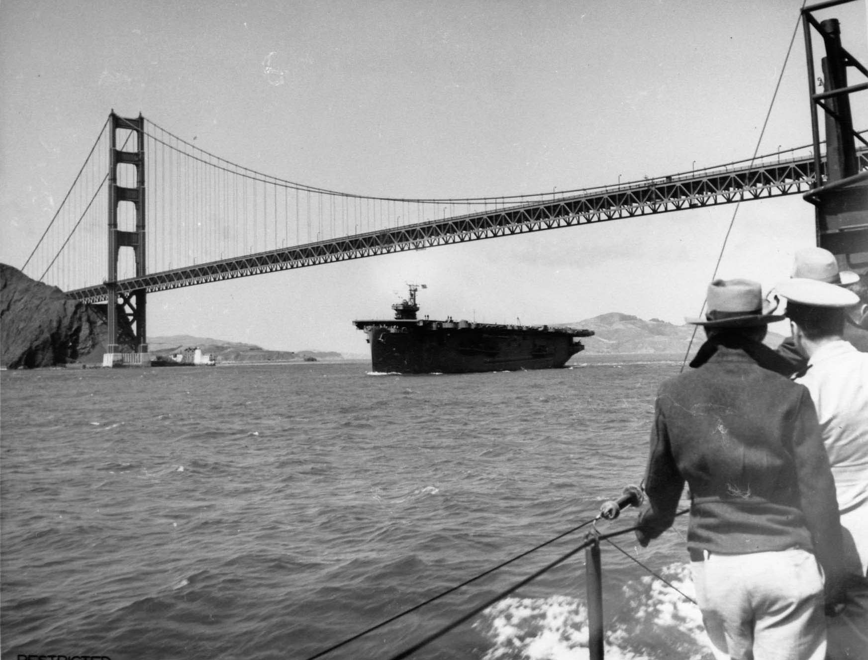 USS Copahee passing under the Golden Gate Bridge, San Francisco Bay, California, United States, 15 Jul 1943