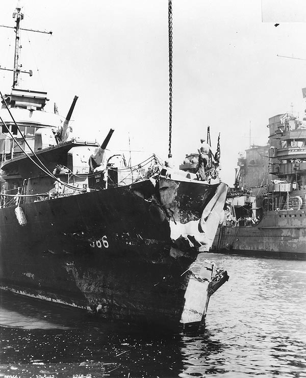 Drayton's damaged bow after colliding with destroyer Flusser, Pearl Harbor, 5 Oct 1942; note cruiser Portland and carrier Saratoga partially visible in background