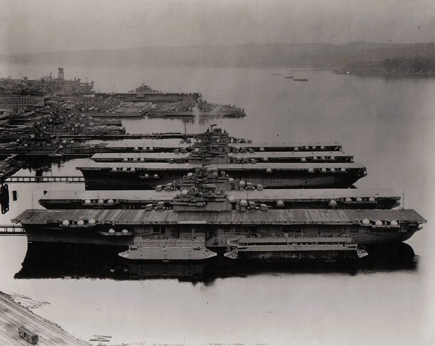 USS Essex, USS Ticonderoga, USS Yorktown, USS Lexington, USS Bunker Hill, and and USS Bon Homme Richard at Puget Sound Naval Shipyard, Washington, United States, 23 Apr 1948; note several battleships in background at left