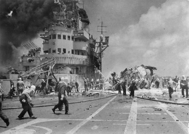 Firefighting aboard HMS Formidable after she was struck by a Japanese special attack aircraft in the Pacific Ocean off Sakishima Islands, Japan, 4 May 1945, photo 2 of 2