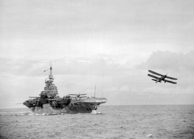 Albacore aircraft of No. 820 Squadron FAA having just taken off from HMS Formidable in the Indian Ocean, 29 May 1942; photo taken from HMS Warspite
