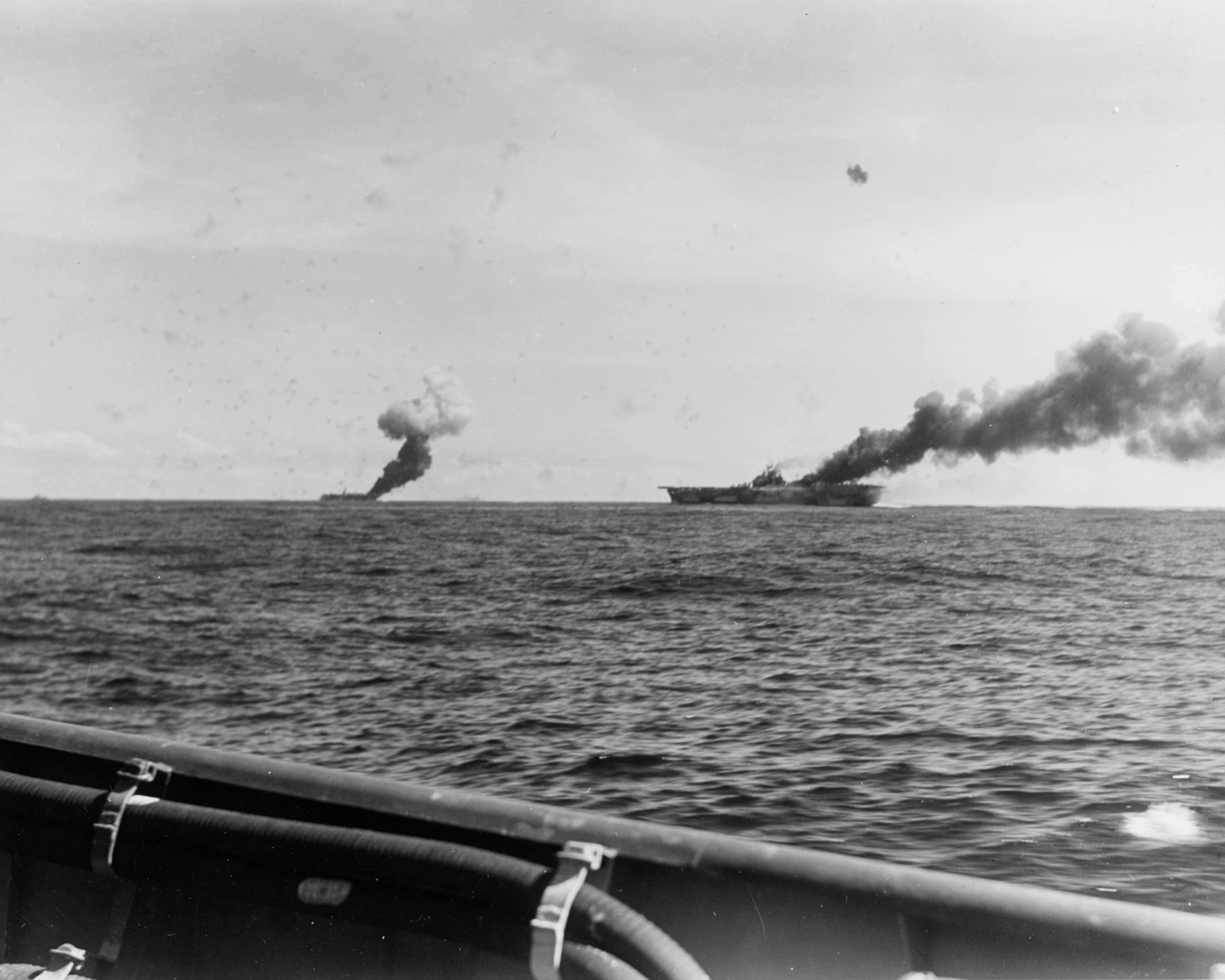 Carriers Belleau Wood and Franklin afire after being hit by suicide aircraft, off Samar, Philippine Islands, 30 Oct 1944