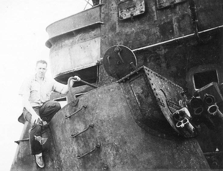 A sailor of cruiser Helena studied Admiral Graf Spee's forward broadside director and range finder, 2 Feb 1940
