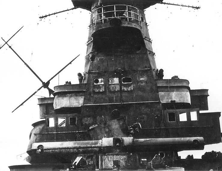 Admiral Graf Spee's forward superstructure, looking aft, with the conning tower rangefinder in the foreground and the mainmast partially collapsed in the left background, 2 Feb 1940