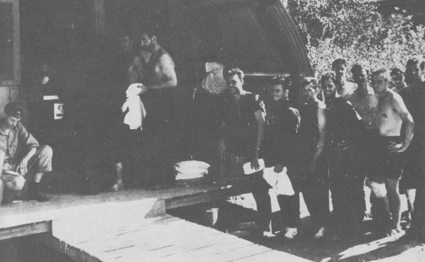 Survivor of USS Helena receiving clothing and gear on Tulagi, Solomon Islands, circa 7 Jul 1943