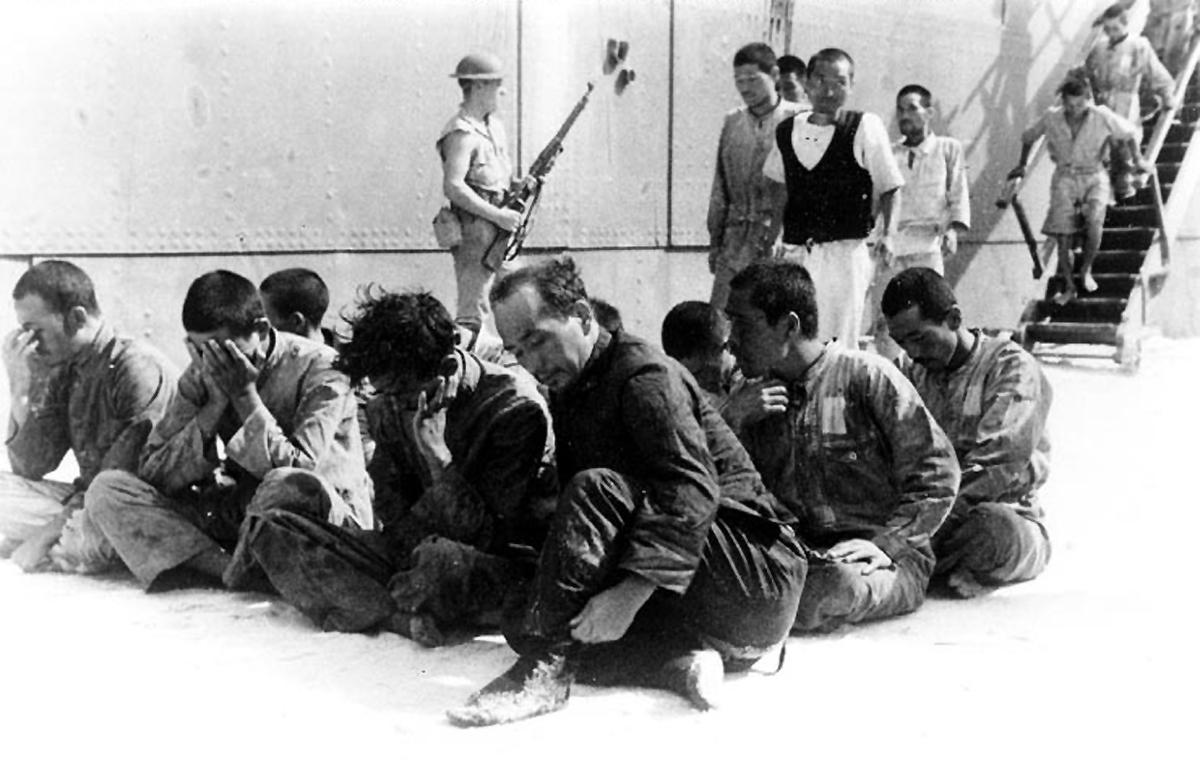 Survivors of Hiryu disembarking USS Ballard at Midway, 20 Jun 1942. Ballard rescued 35 Japanese sailors the previous day after two weeks in an open boat. One died while en route Midway and was buried at sea.