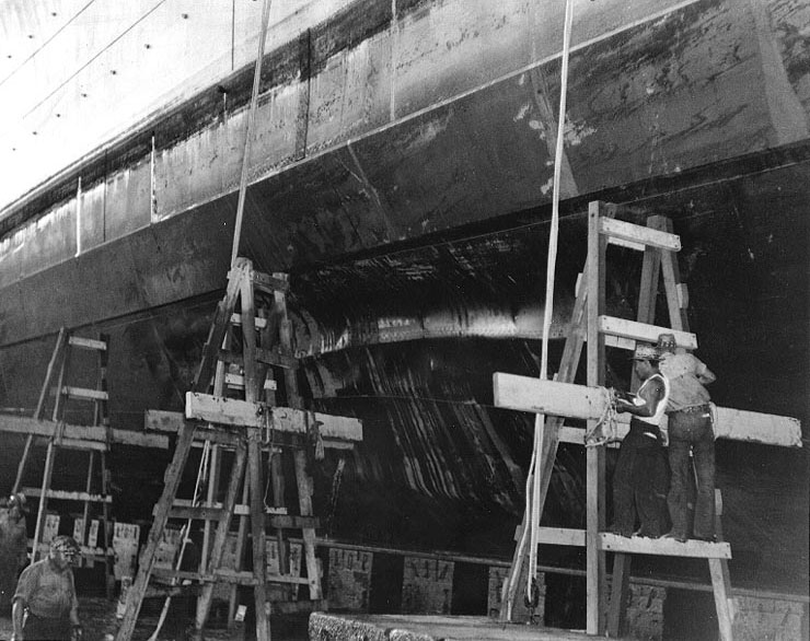 Cruiser Honolulu drydocked for damage suffered during Pearl Harbor attack, Pearl Harbor Navy Yard, 13 Dec 1941, photo 1 of 2