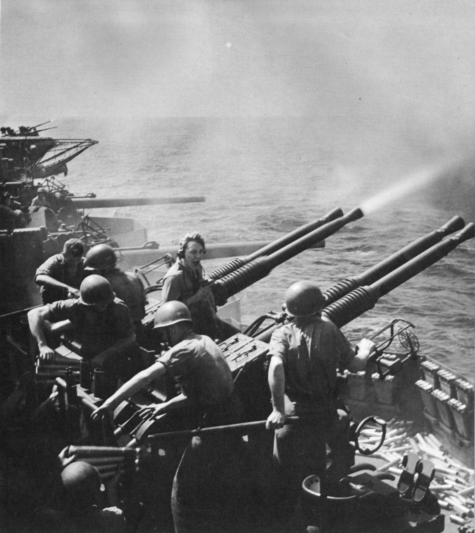 Gunnery practice with 40-mm Bofors MK 12 anti-aircraft guns aboard Hornet while her aircraft raided Japan, 16 Feb 1945