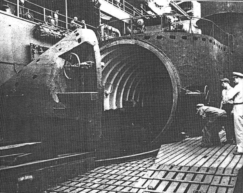 US Navy personnel inspecting the hangar of Japanese submarine I-400, circa late 1945 or early 1946