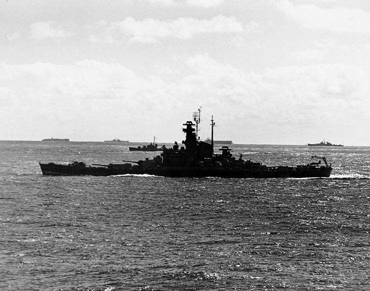 Battleship Indiana underway en route to attack Tokyo, Japan with Task Force 58.1, 12 Feb 1945; note ships of Task Group 58.3 in background