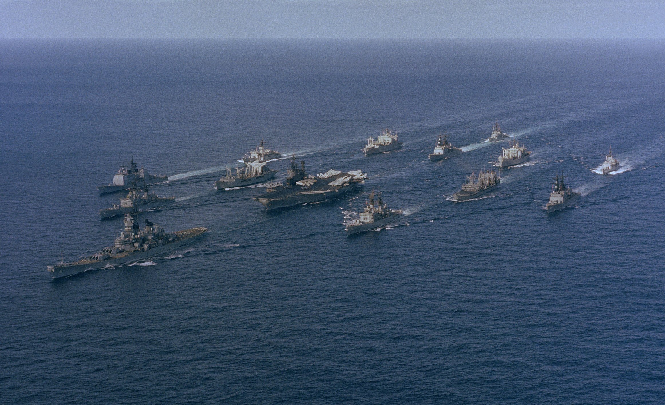 USS Iowa, USS Midway, and other ships of US Navy Battle Group Alpha underway, 1 Dec 1987