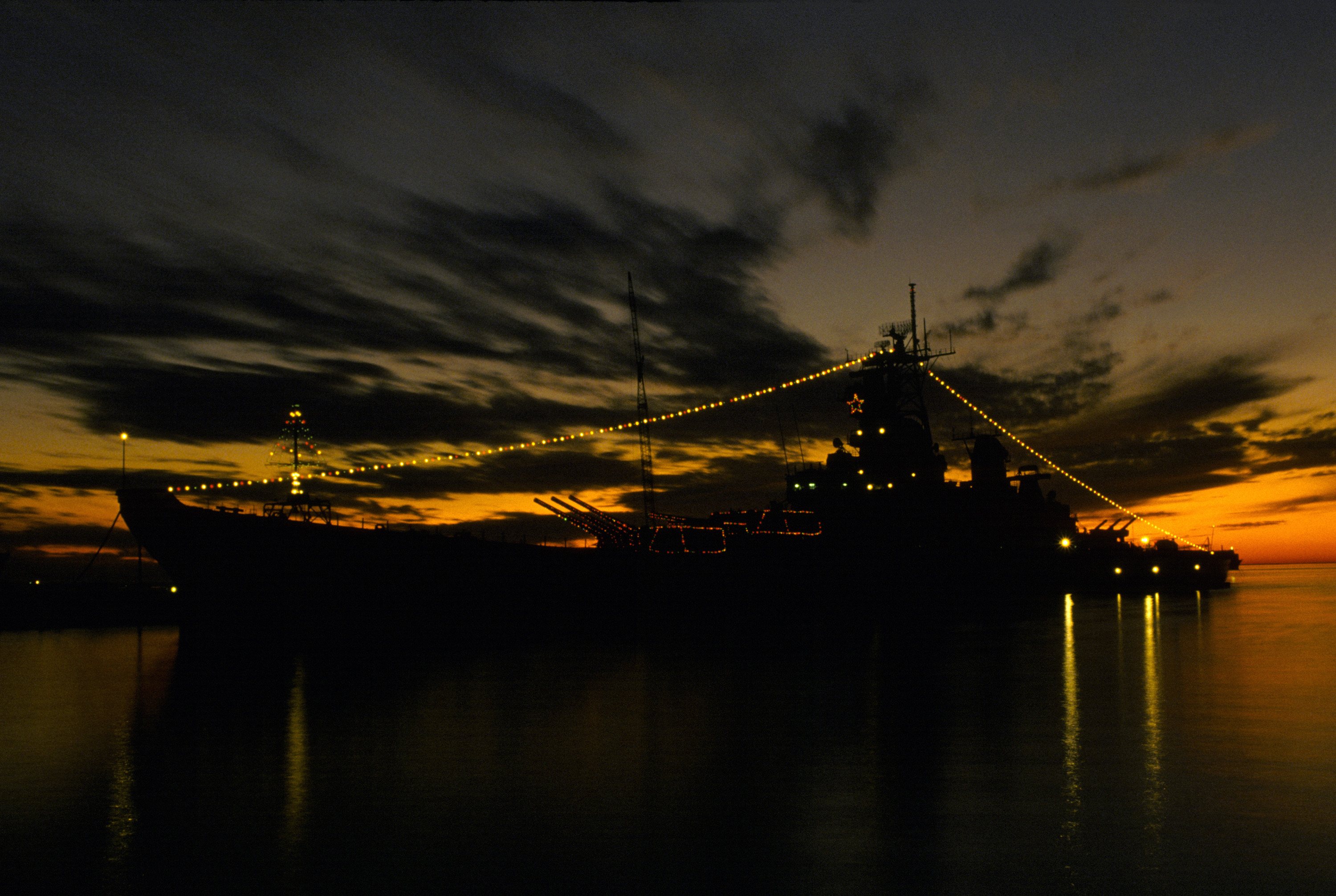 USS Iowa decorated for the Christmas holiday, Naval Air Station Norfolk, Virginia, United States, 15 Dec 1984