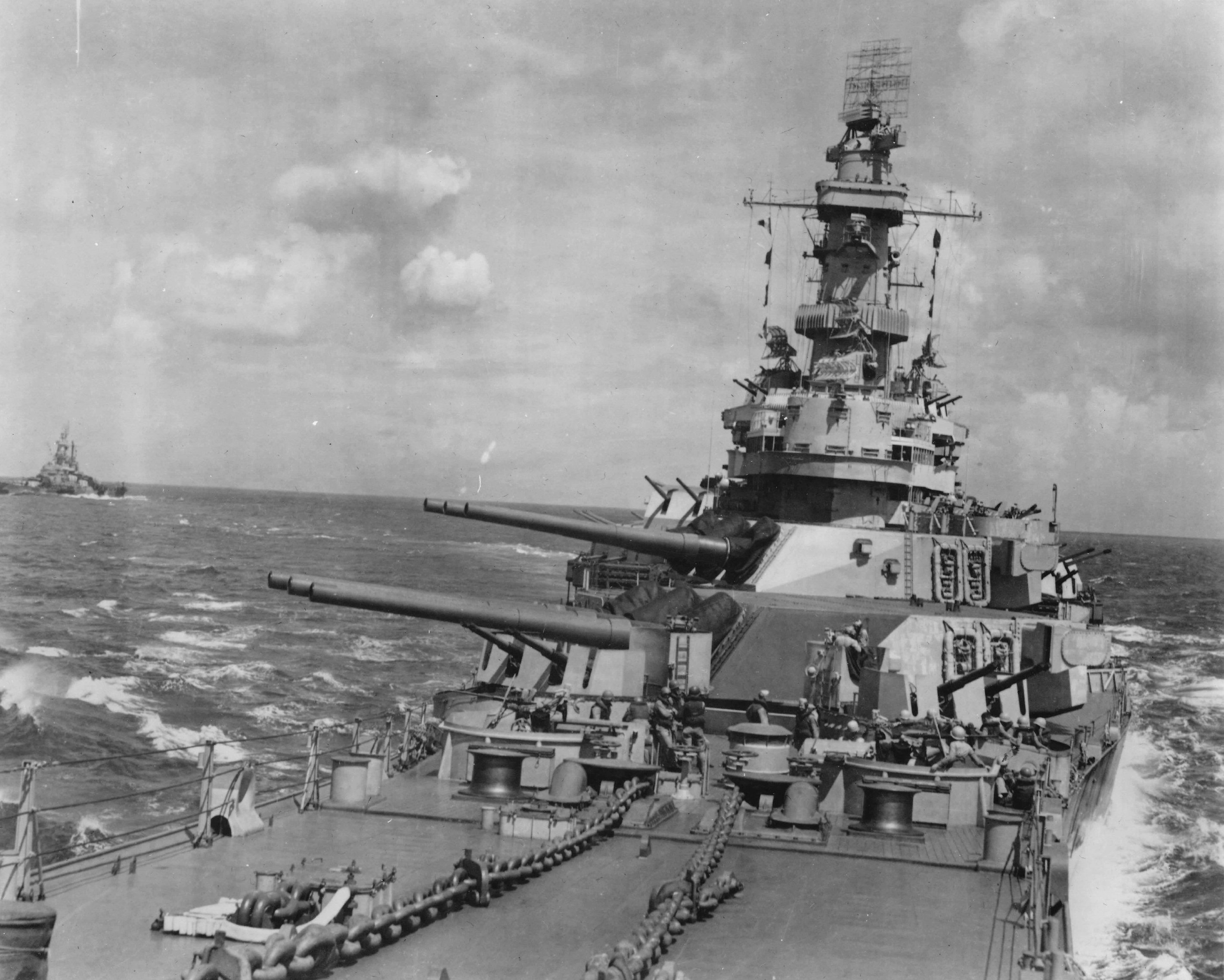 Forward guns and superstructure of USS Iowa underway during the Marshall Islands Campaign alongside USS Indiana, 24 Jan 1944.