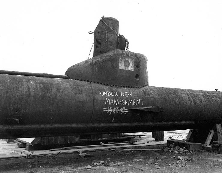 A Kairyu-class submarine at Yokosuka Naval Base, Japan, 7 Sep 1945; note grafitti drawn by American personnel