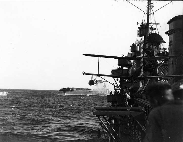 Destroyers evacuating Lexington's crew, 8 May 1942, filmed by crew of cruiser Minneapolis, photo 2 of 2; note SOC Seagull aircraft onboard Minneapolis
