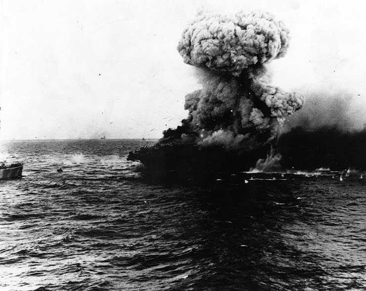Mushroom cloud rose above USS Lexington after an explosion, 8 May 1942; carrier Yorktown on horizon and destroyer Hammann to the left of photograph