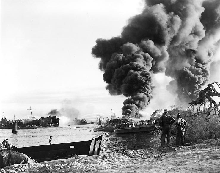 Tugs and other craft tried to put out fires on LST-480 resulted from an explosion from the previous day, Pearl Harbor, 22 May 1944
