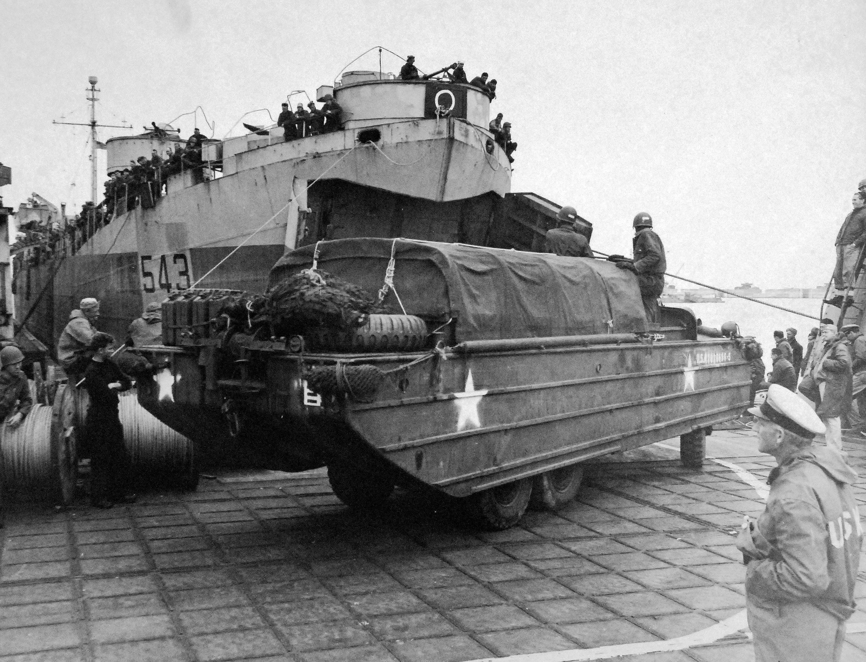 DUKW loaded with supplies for supplying the Normandy beachhead boarding LST-543, England, United Kingdom, Jun 1944, photo 2 of 2