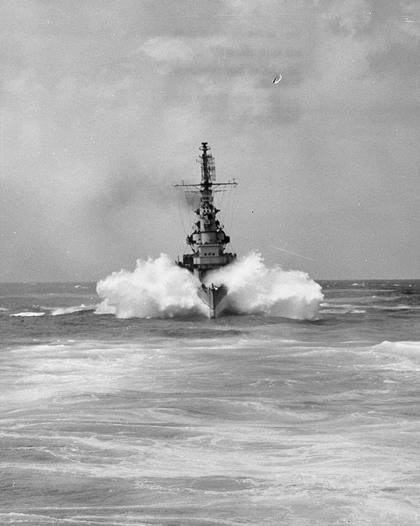 USS Miami prowing through a wave during her shakedown cruise, 17 Feb 1944; photo taken from USS Quincy