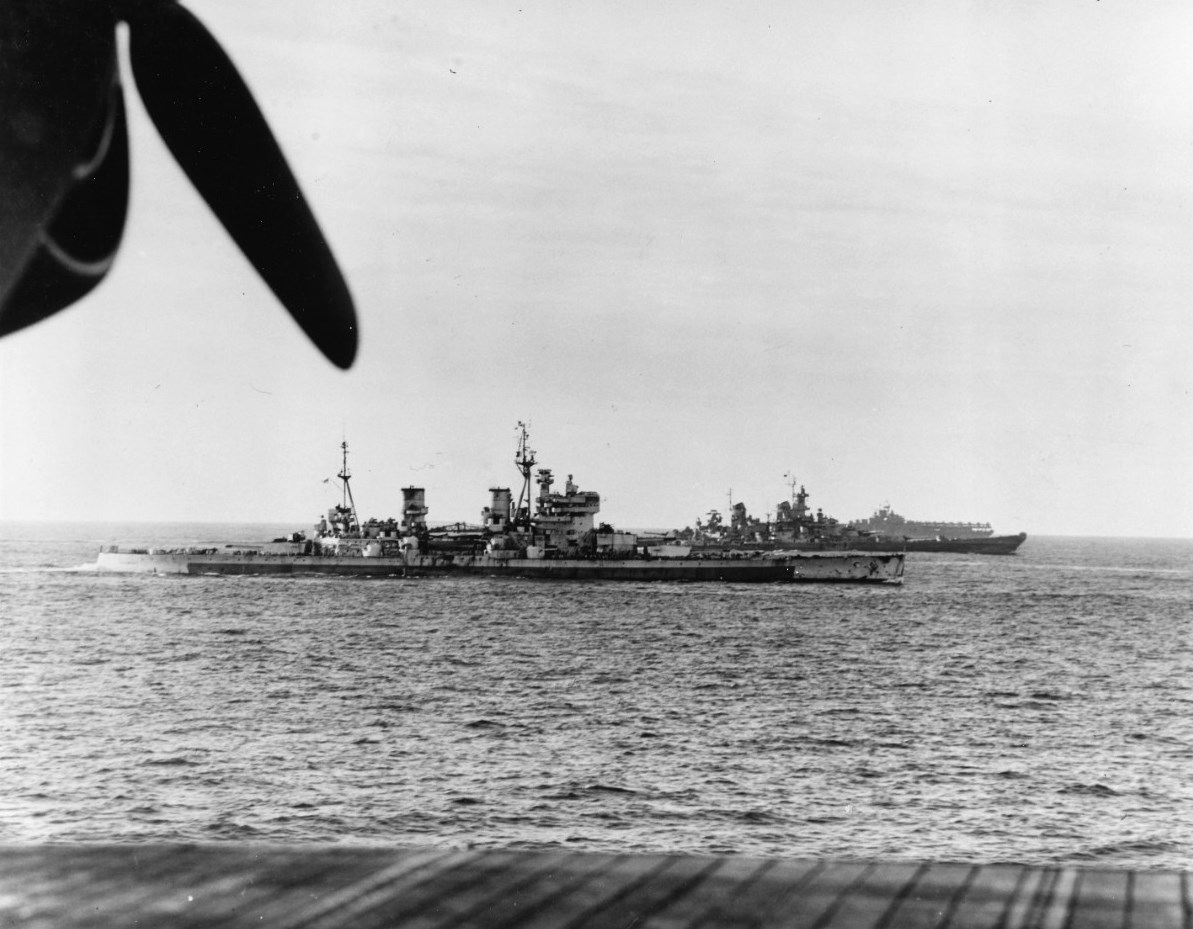 HMS King George V, USS Missouri, a British destroyer, and an American Essex-class carrier at sea off Japan, 16 Aug 1945