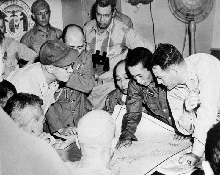 American and Japanese officers reviewed charts of Sagami and Tokyo Bays aboard Missouri, 27 Aug 1945