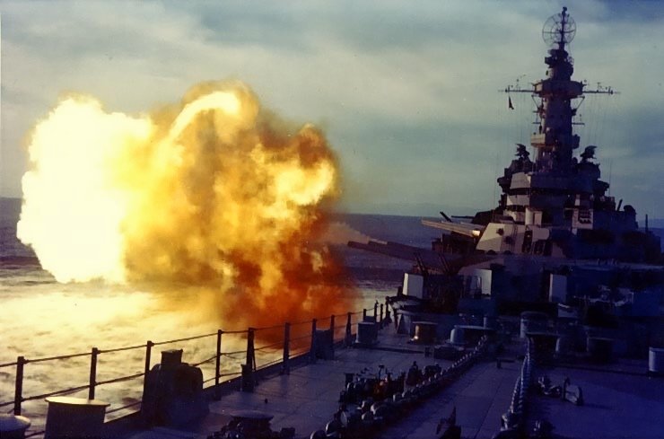 Battleship Missouri firing a salvo during her shakedown period, Aug 1944