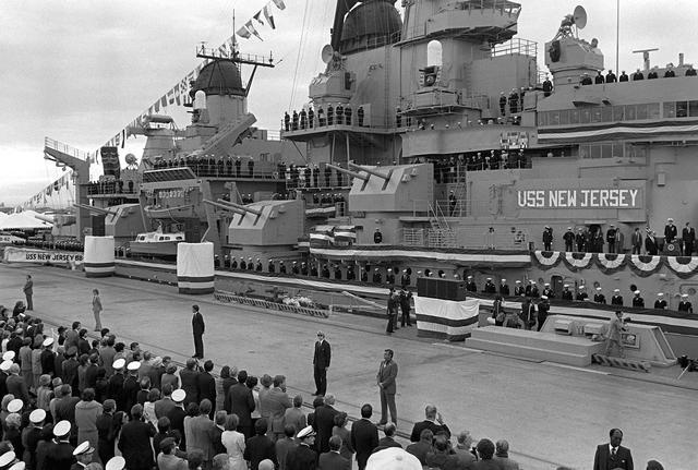 US President Ronald Reagan (extreme right of photo) speaking at USS New Jersey's recommissioning ceremony, Long Beach, California, United States, 28 Dec 1982